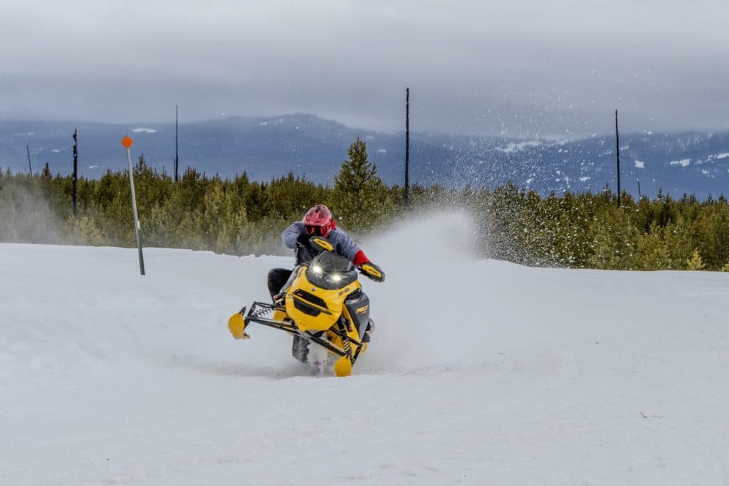 rider maneuvering skidoo mxz xrs 850 turbo r 2025 on a snowy trail